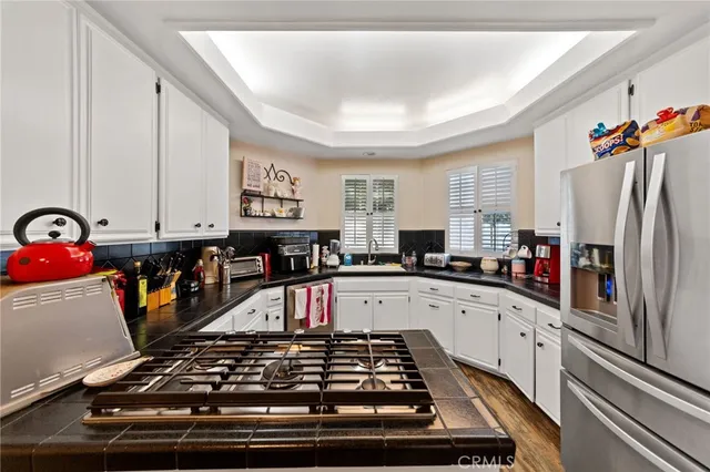a kitchen with lots of appliances and cabinets