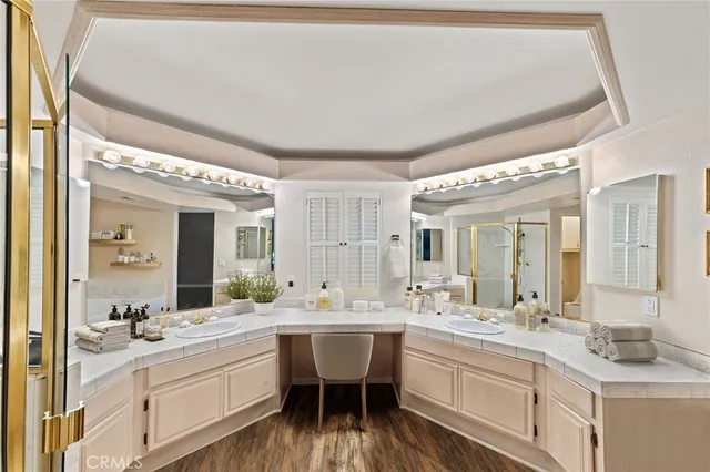a bathroom with a double vanity sink and a mirror
