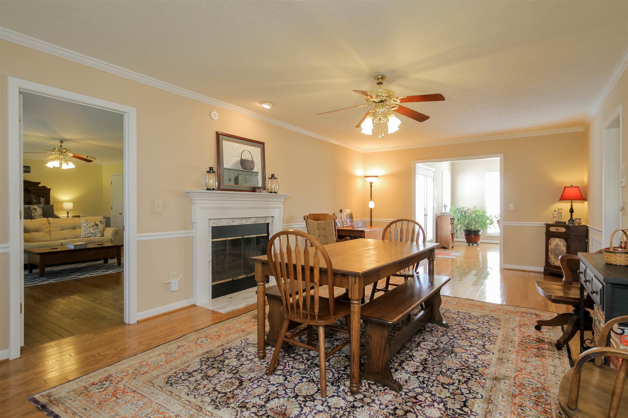 408 Ranch Road Portland, TN 37148 - Photo 11 of 29 This room also features a gas fireplace, chair railing, crown molding and hardwood floors. It is located right off of kitchen and den.