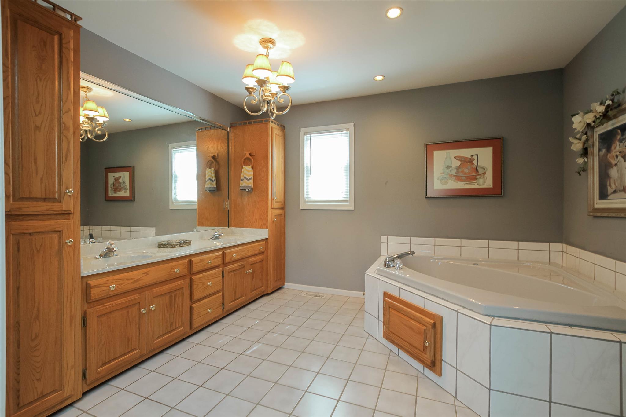 408 Ranch Road Portland, TN 37148 - Photo 13 of 29 Master bath has plenty of room. Double sinks, lots of cabinets, tiled floor, linen closet, Jacuzzi tub, separate shower & toilet area.