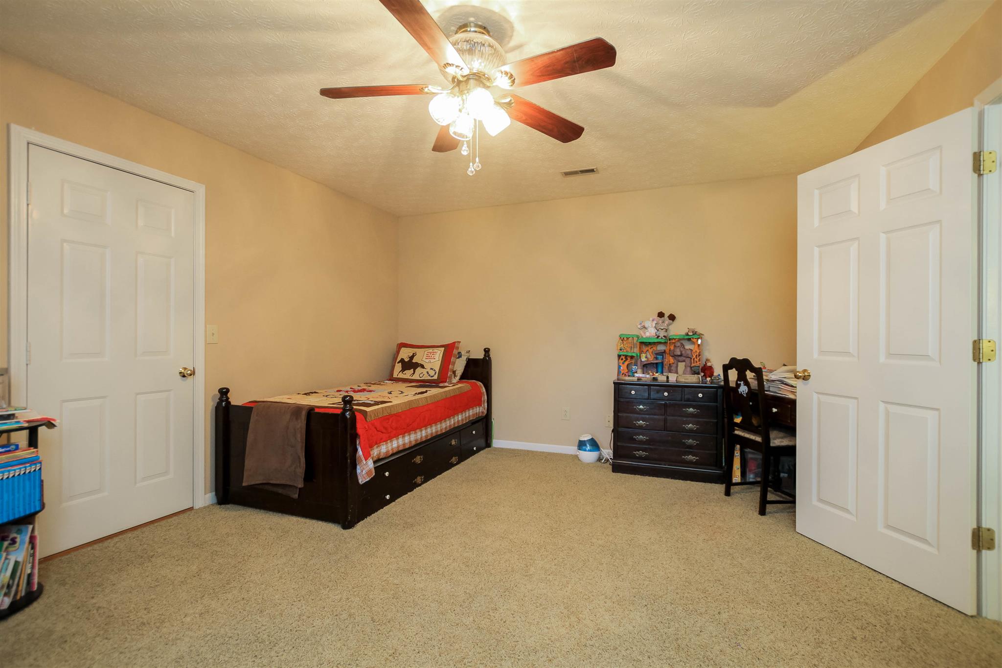 408 Ranch Road Portland, TN 37148 - Photo 15 of 29 All secondary bedrooms are upstairs. This room has double closets and a dormer window. There is access to the large walk-in attic which has tons of storage. There is also a full hall bath off this room.