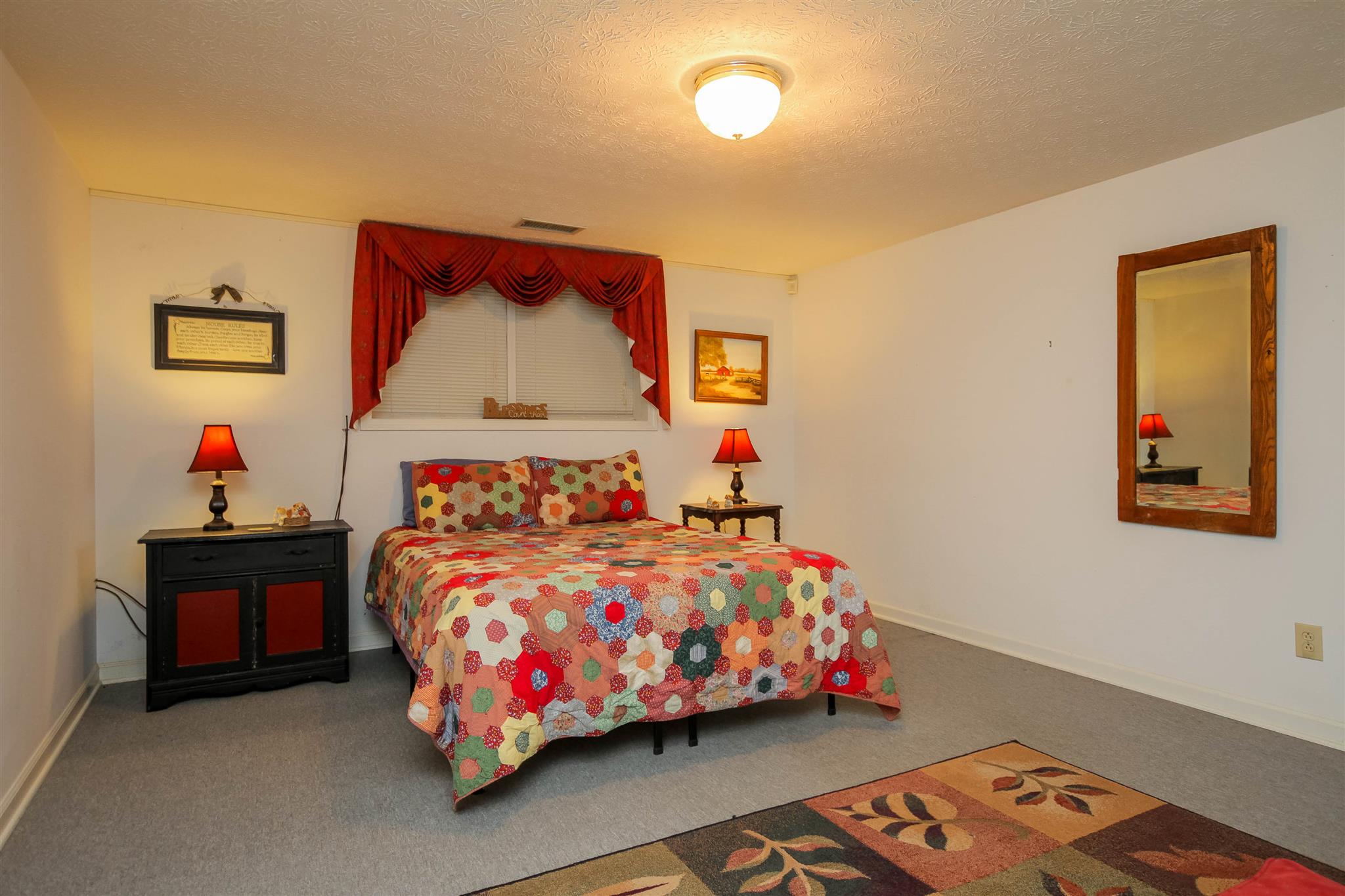 408 Ranch Road Portland, TN 37148 - Photo 19 of 29 Currently the family is using this room in the basement as a guest bedroom. It also could be a workout room, hobby room, etc. The possibilities are endless.