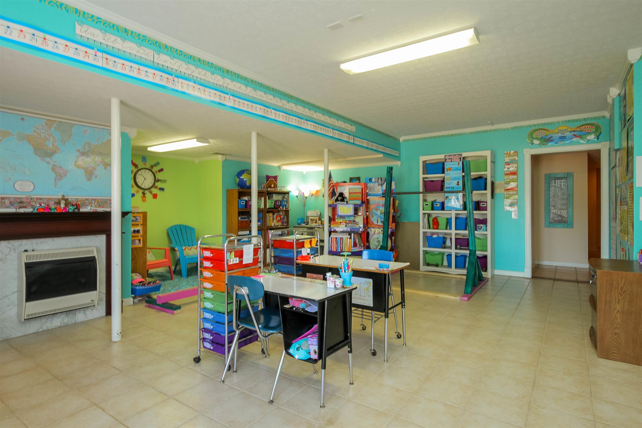 408 Ranch Road Portland, TN 37148 - Photo 21 of 29 Gas heat fireplace adds to this space. Right now it's an adorable classroom.
