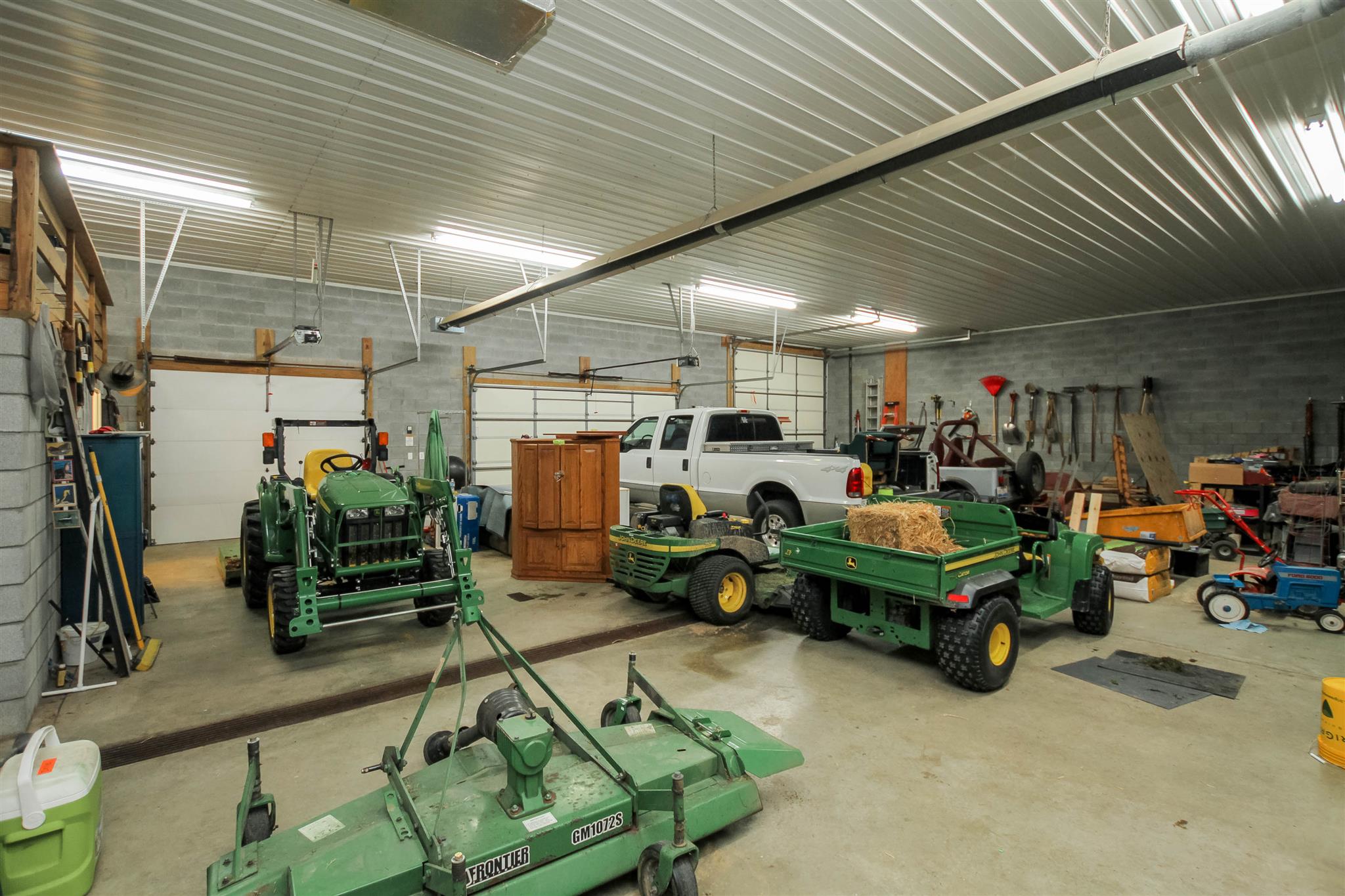 408 Ranch Road Portland, TN 37148 - Photo 22 of 29 What a "man cave"! Who wouldn't love this 3 car 48x64, detached garage. Insulated garage doors, water spicket, drain system, full bathroom, kitchen and storage.
