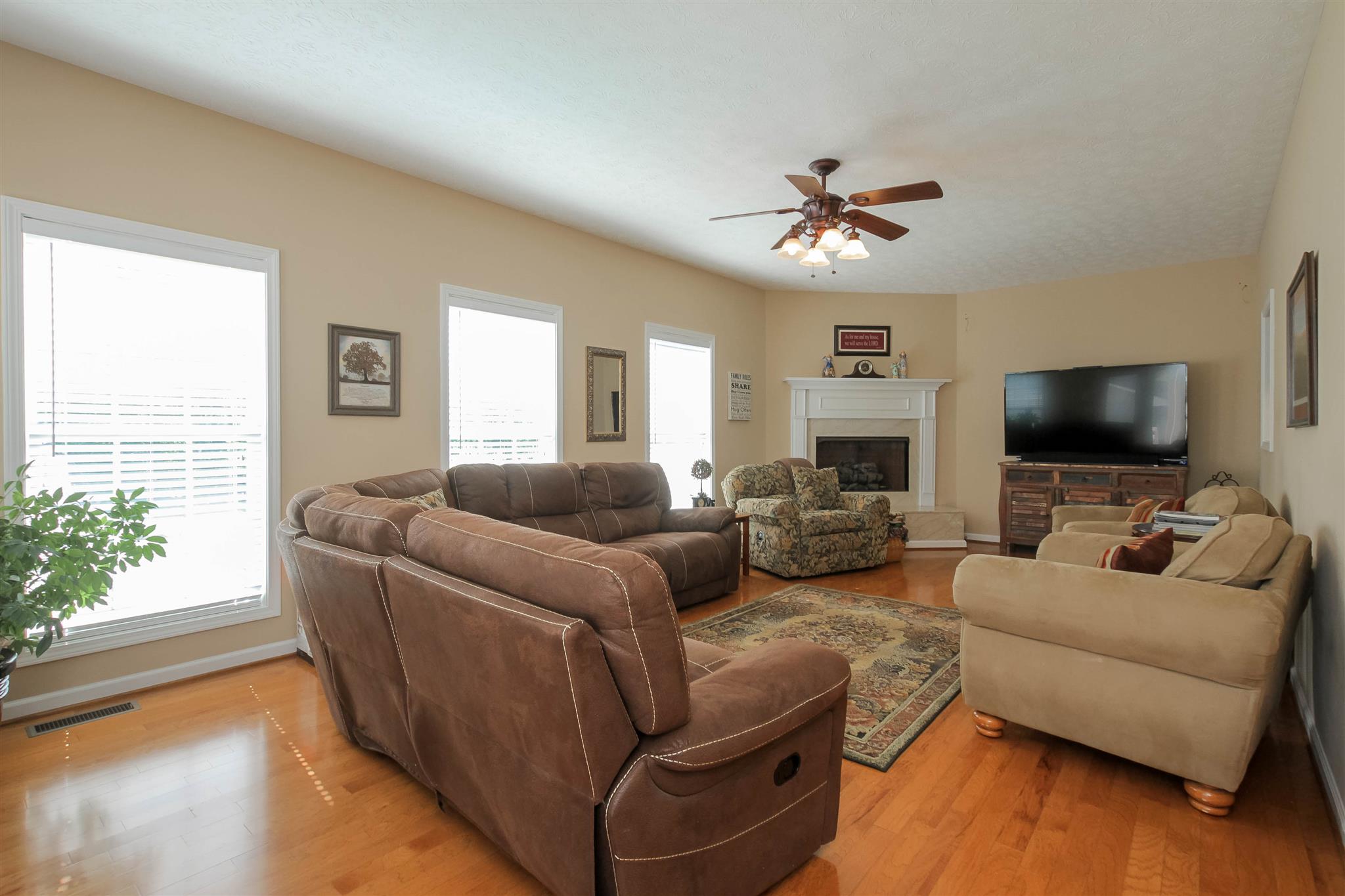 408 Ranch Road Portland, TN 37148 - Photo 8 of 29 The den has is a great place for family and friends to unwind. Lots of windows for natural light and a gas fireplace add to the finishing touches.