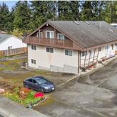 a house with lots of trees in the background