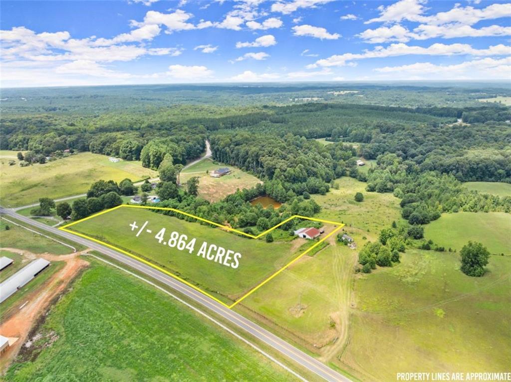 a view of a swimming pool with a yard