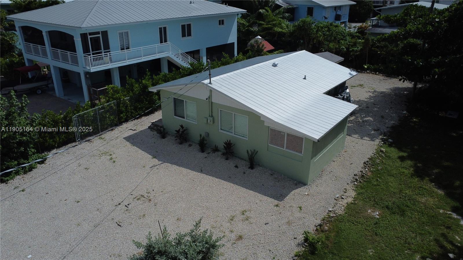 59 Tarpon Avenue Key Largo, FL 33037 - Photo 3 of 16 an aerial view of a house with a yard