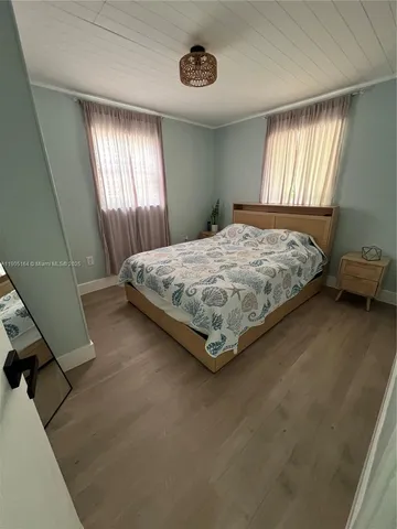 a bathroom with a toilet a sink and window