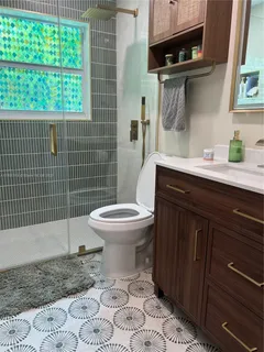 a living room with furniture a couch and dresser