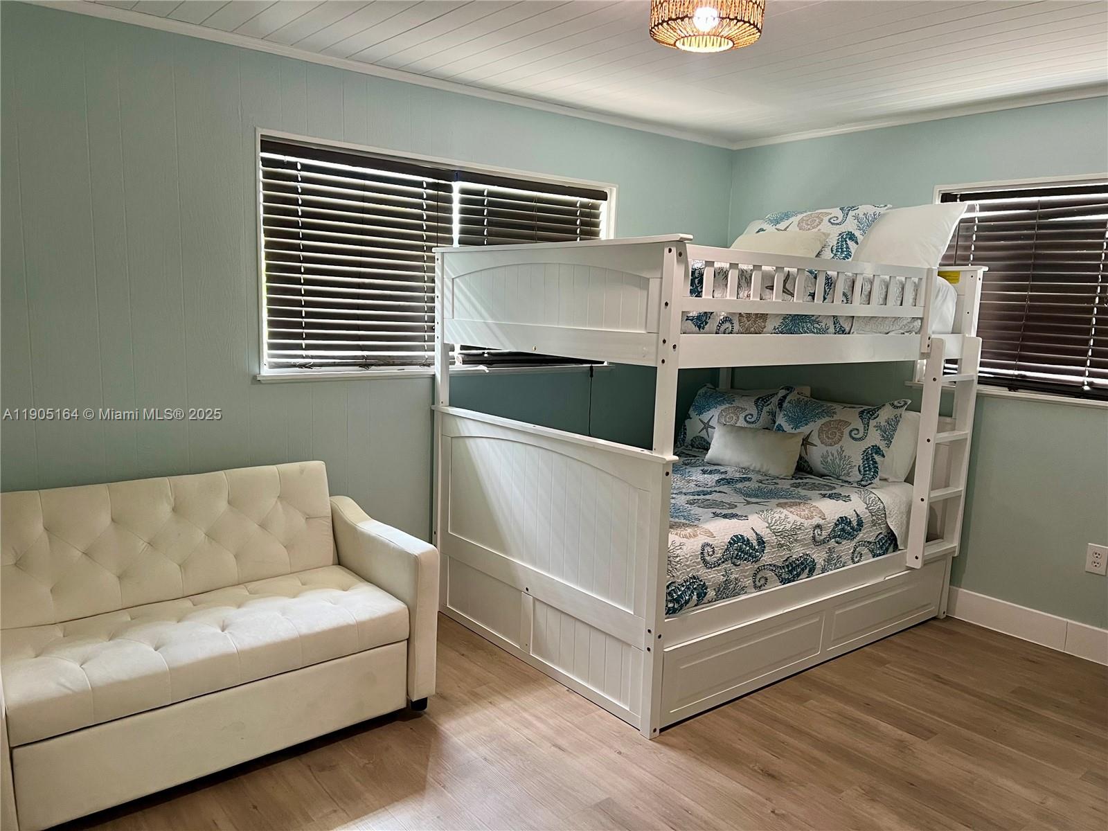 59 Tarpon Avenue Key Largo, FL 33037 - Photo 10 of 16 a living room with furniture a couch and dresser