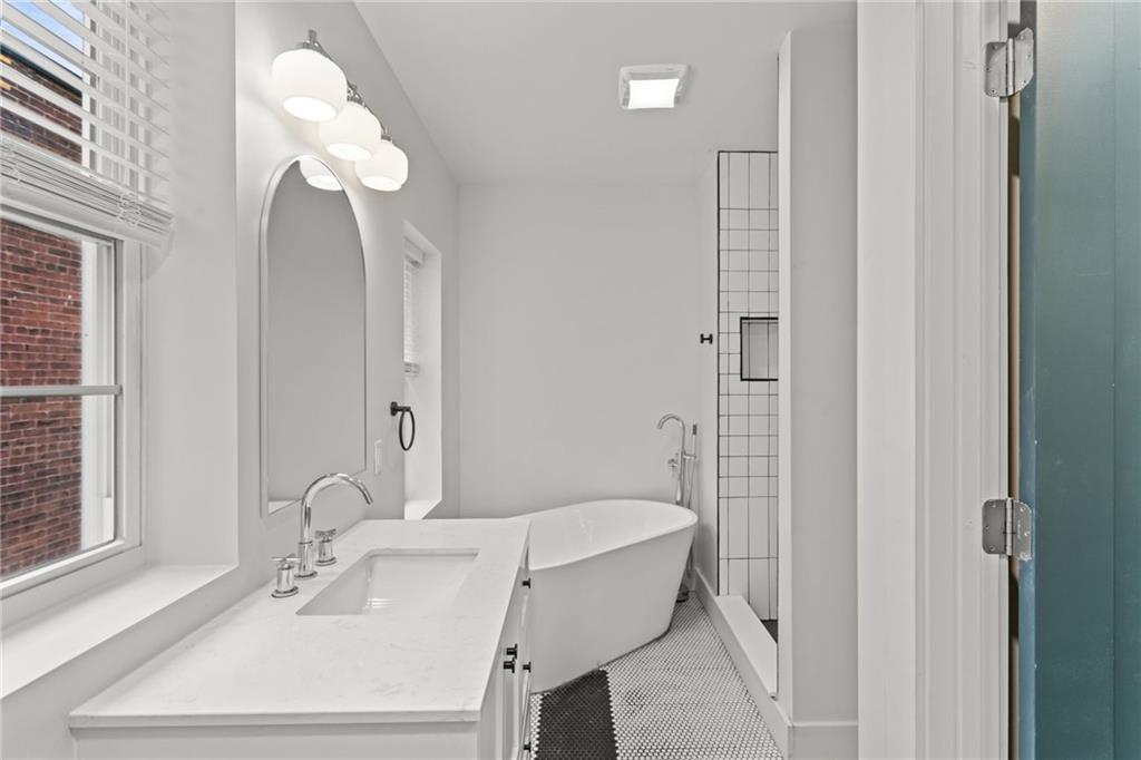 2011 Forbes Avenue Pittsburgh, PA 15219 - Photo 28 of 41 a bathroom with a sink a toilet and shower