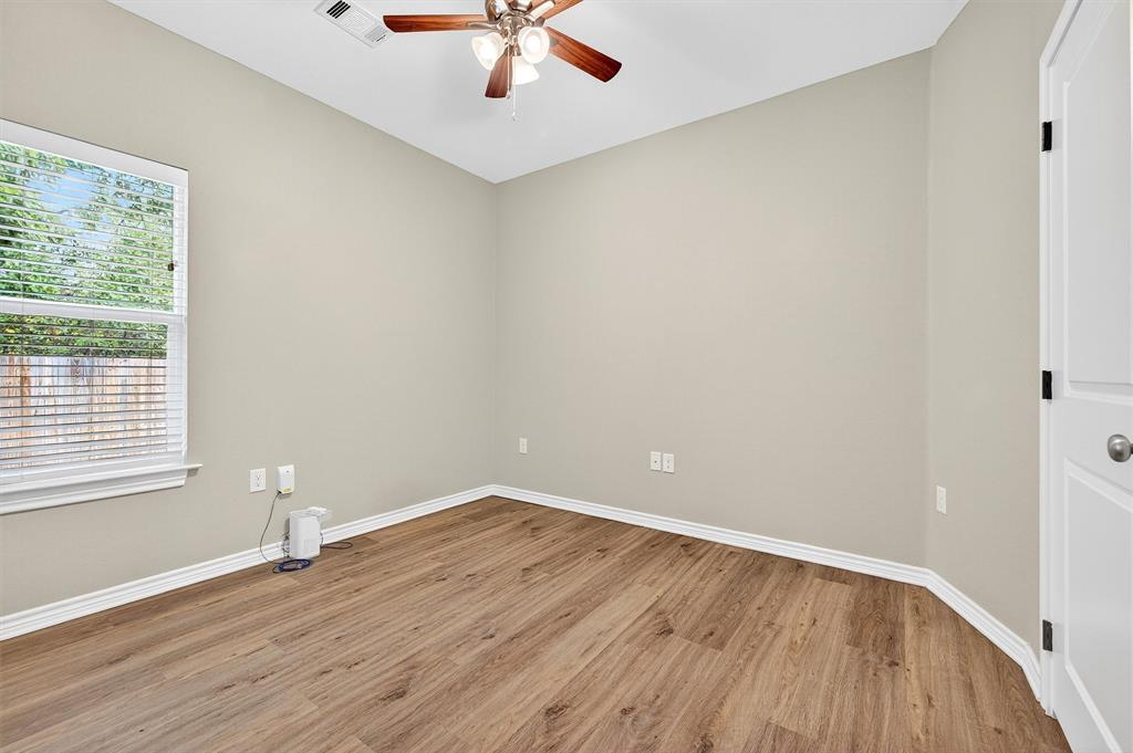 508 Goodjohn Street Collinsville, TX 76233 - Photo 24 of 40 Spare room featuring light wood-style floors and a ceiling fan