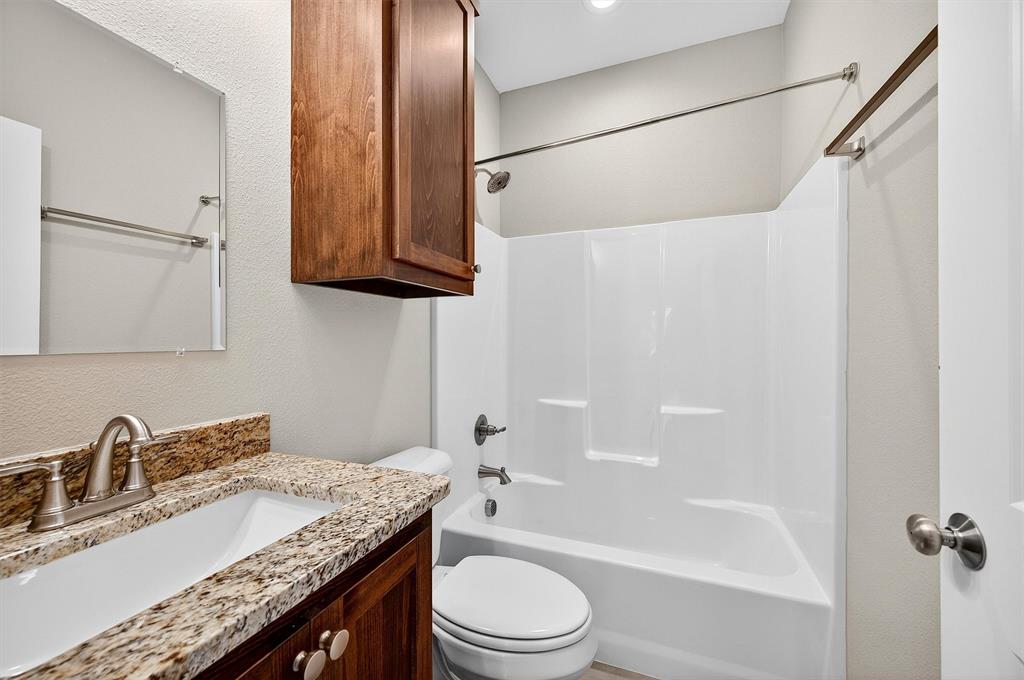 508 Goodjohn Street Collinsville, TX 76233 - Photo 25 of 40 Full bathroom featuring shower / tub combination and vanity