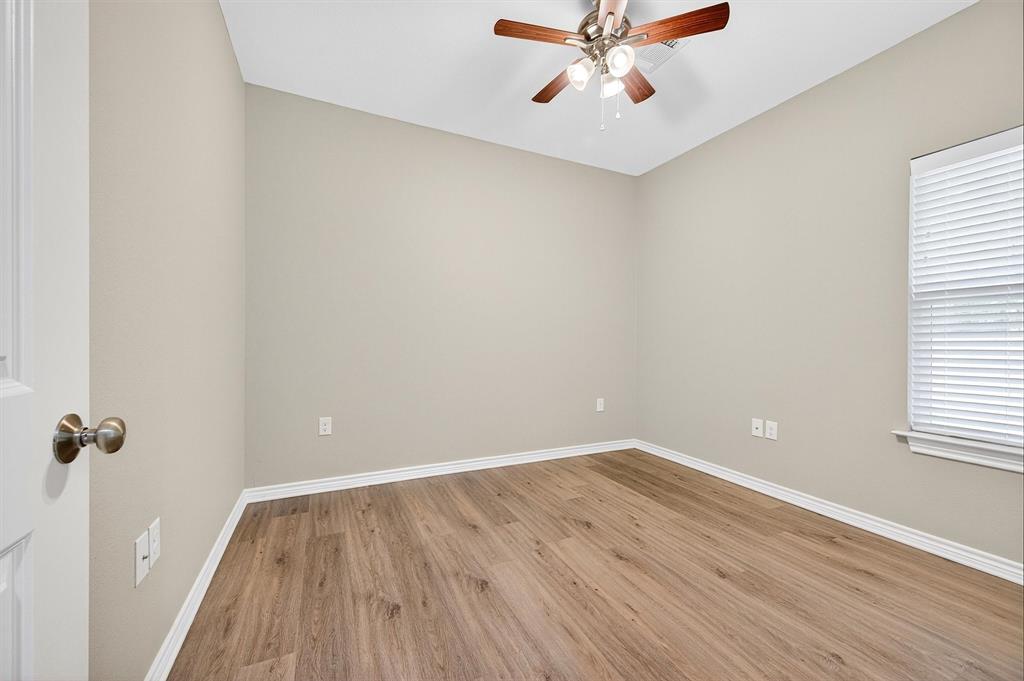 508 Goodjohn Street Collinsville, TX 76233 - Photo 26 of 40 Empty room featuring light wood-style floors and ceiling fan