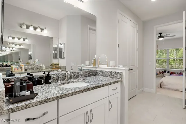 a bathroom with sinks granite countertop a sink and a mirror
