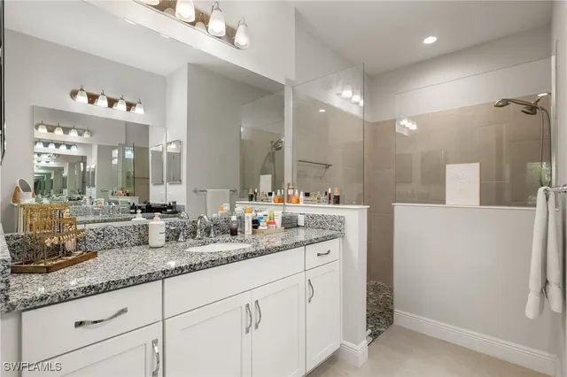 a bathroom with sink and mirror