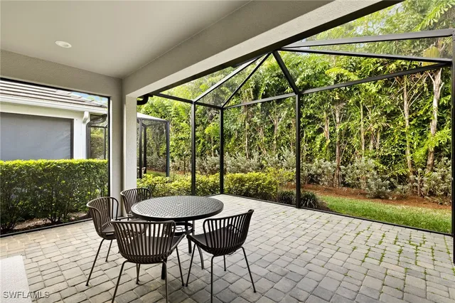 a view of a chairs and table in the patio