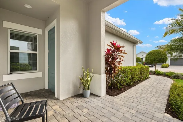 a view of a door and chair in the house