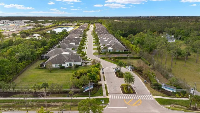 front view of a house with a fountain