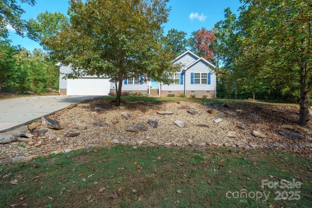 a wooden house with a yard