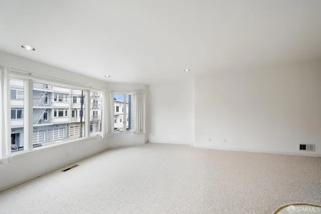 an empty room with windows