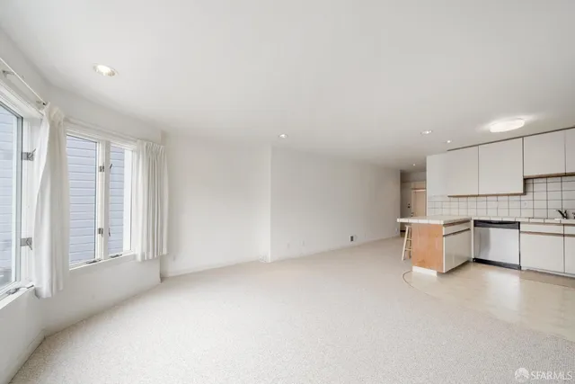 a view of kitchen with furniture and window
