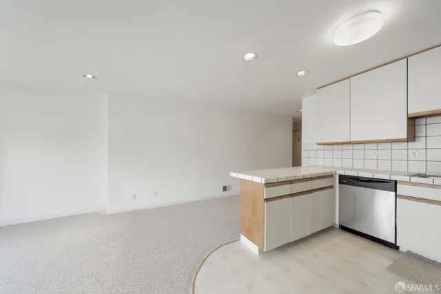 a kitchen with white cabinets