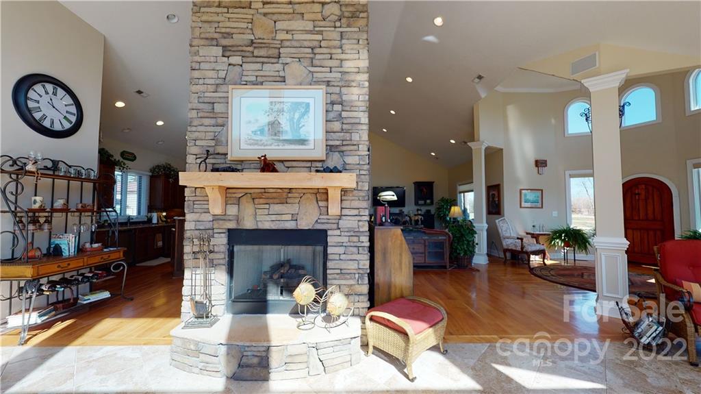 3908 Thompson Road Lancaster, SC 29720 - Photo 12 of 36 a living room with furniture a clock and a fireplace