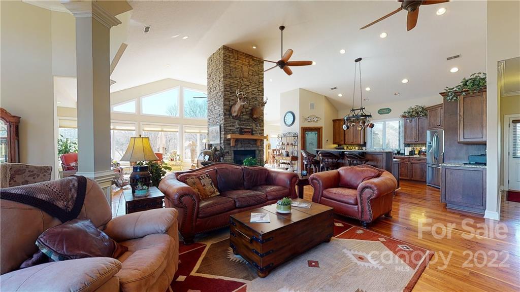 3908 Thompson Road Lancaster, SC 29720 - Photo 15 of 36 a living room with furniture a large window and a chandelier