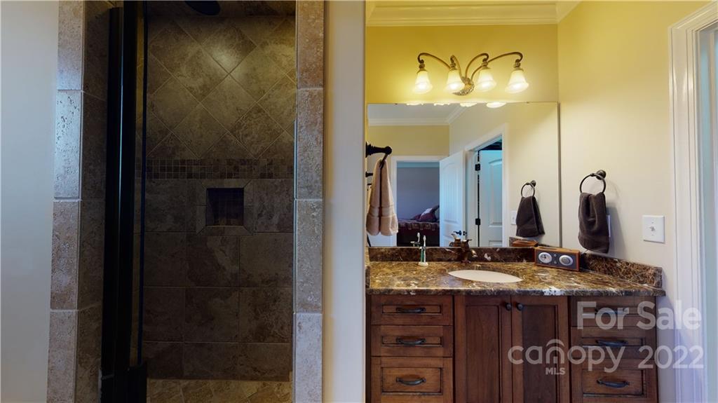 3908 Thompson Road Lancaster, SC 29720 - Photo 26 of 36 a bathroom with a sink and a mirror
