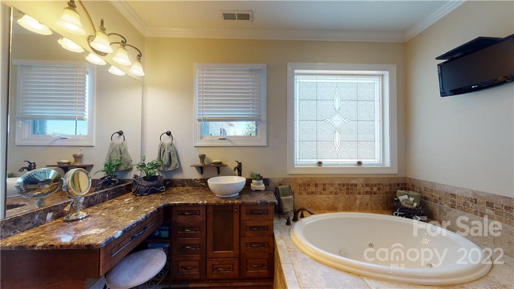3908 Thompson Road Lancaster, SC 29720 - Photo 27 of 36 a bath room with a mirror and a sink