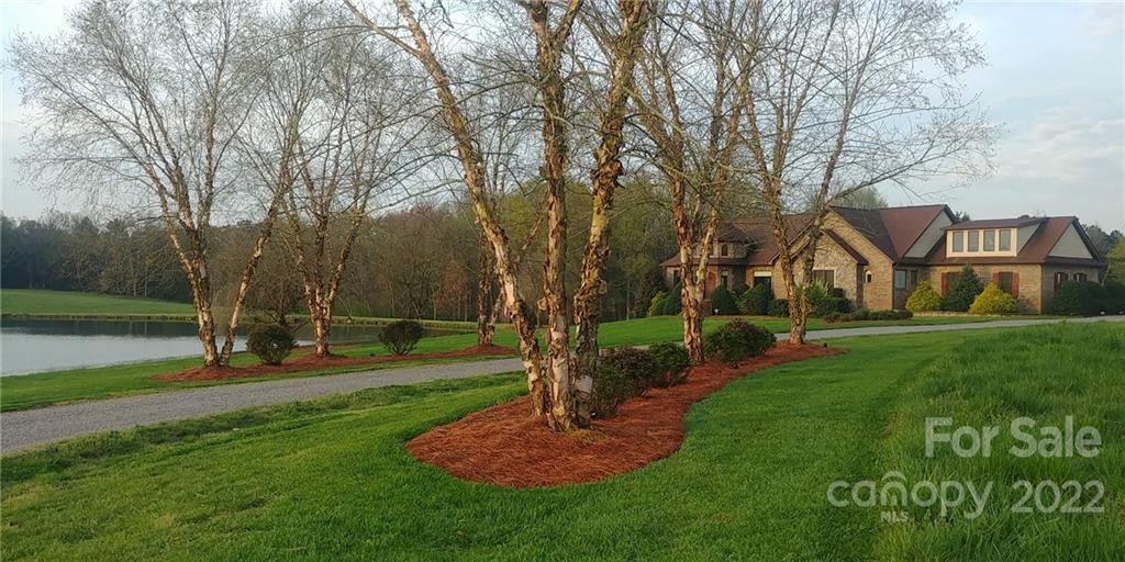 3908 Thompson Road Lancaster, SC 29720 - Photo 32 of 36 a view of a house with a backyard