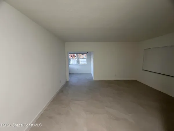 a view of an empty room and window