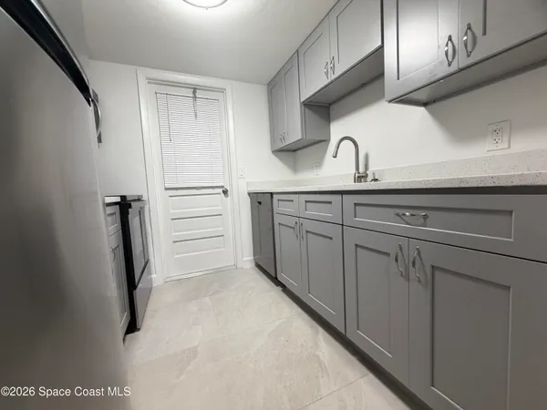 a view of a kitchen with sink