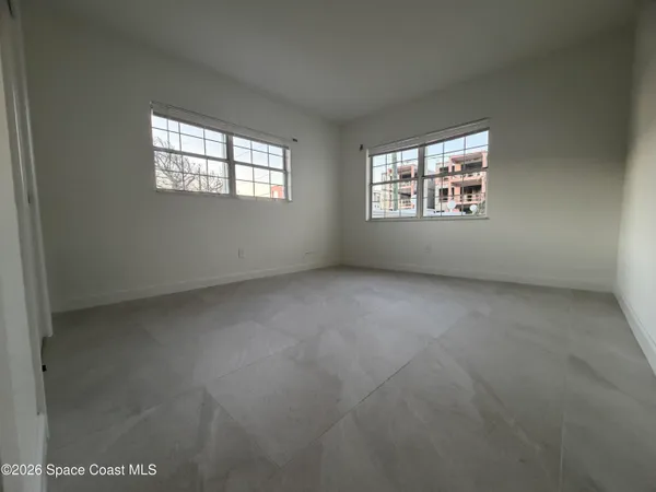 an empty room with windows