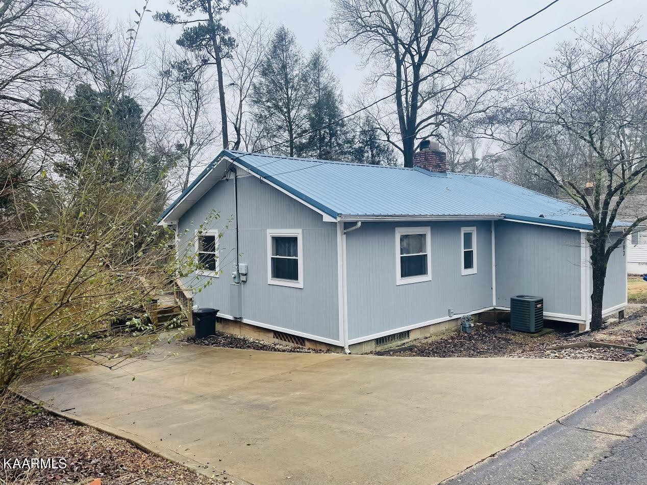303 West Faunce Road Oak Ridge, TN 37830 - Photo 1 of 28 a view of a house with a yard