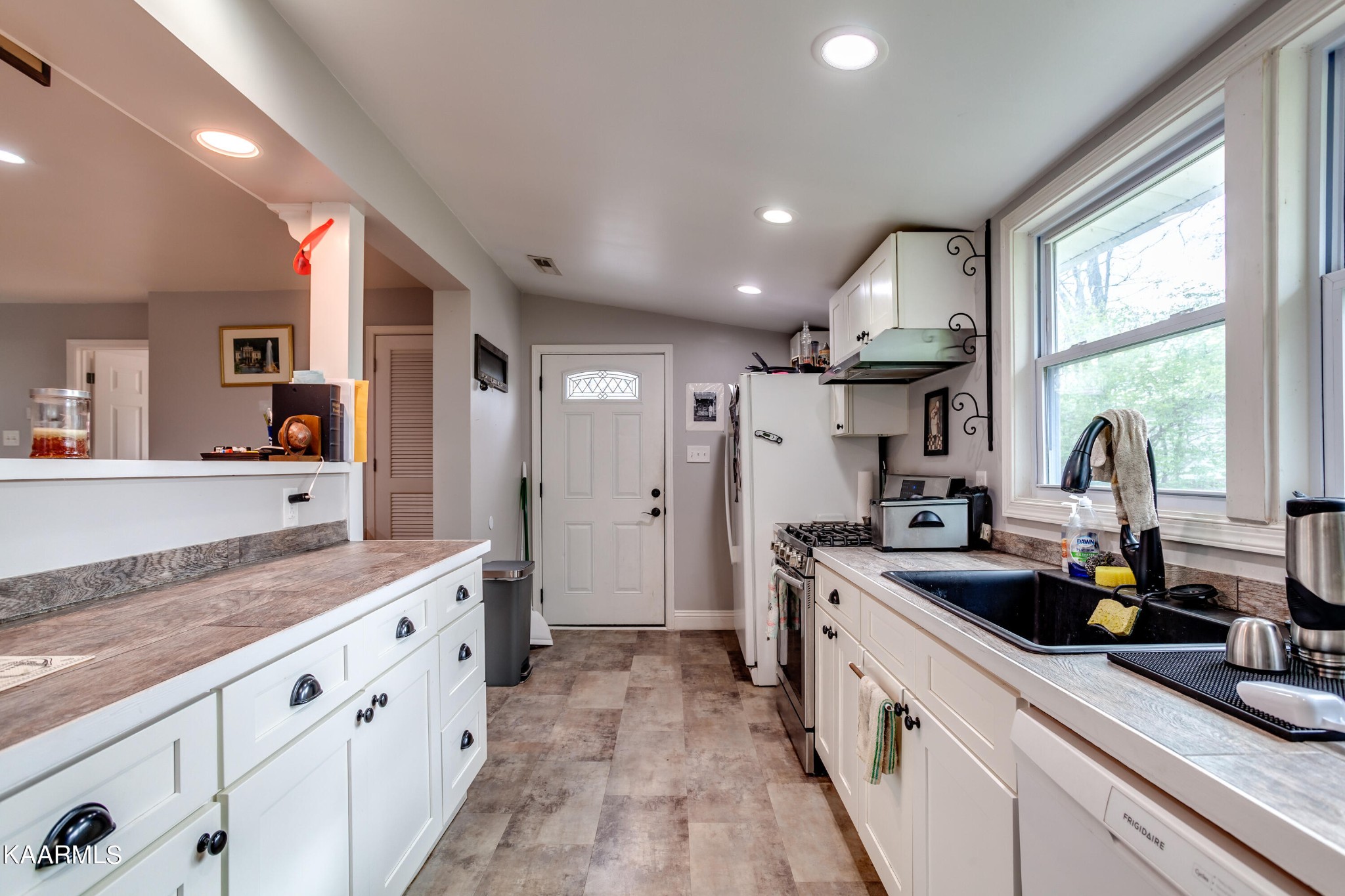 303 West Faunce Road Oak Ridge, TN 37830 - Photo 14 of 28 a large kitchen with stainless steel appliances kitchen island granite countertop a sink and cabinets
