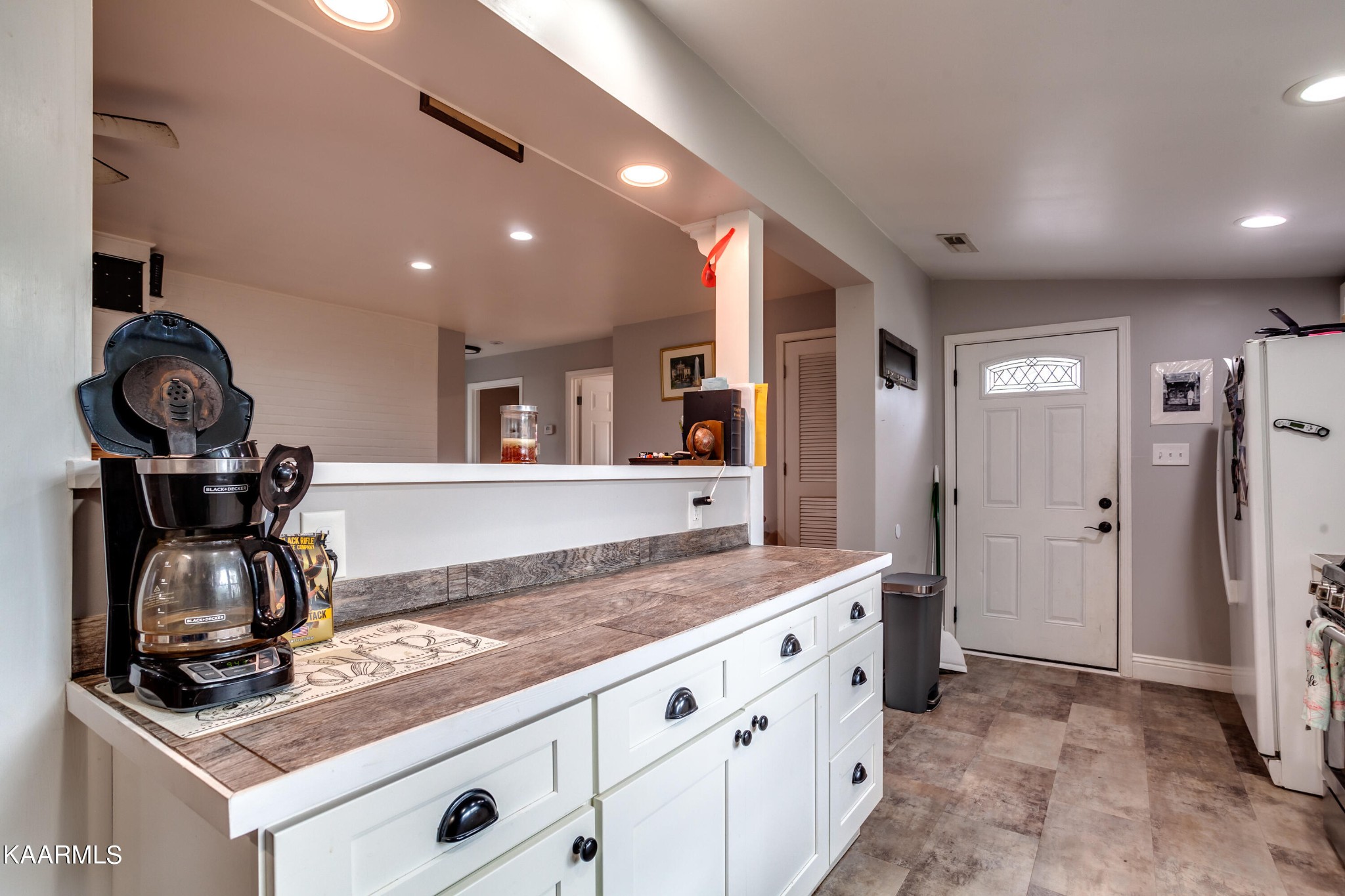 303 West Faunce Road Oak Ridge, TN 37830 - Photo 15 of 28 a kitchen with sink cabinets and stove