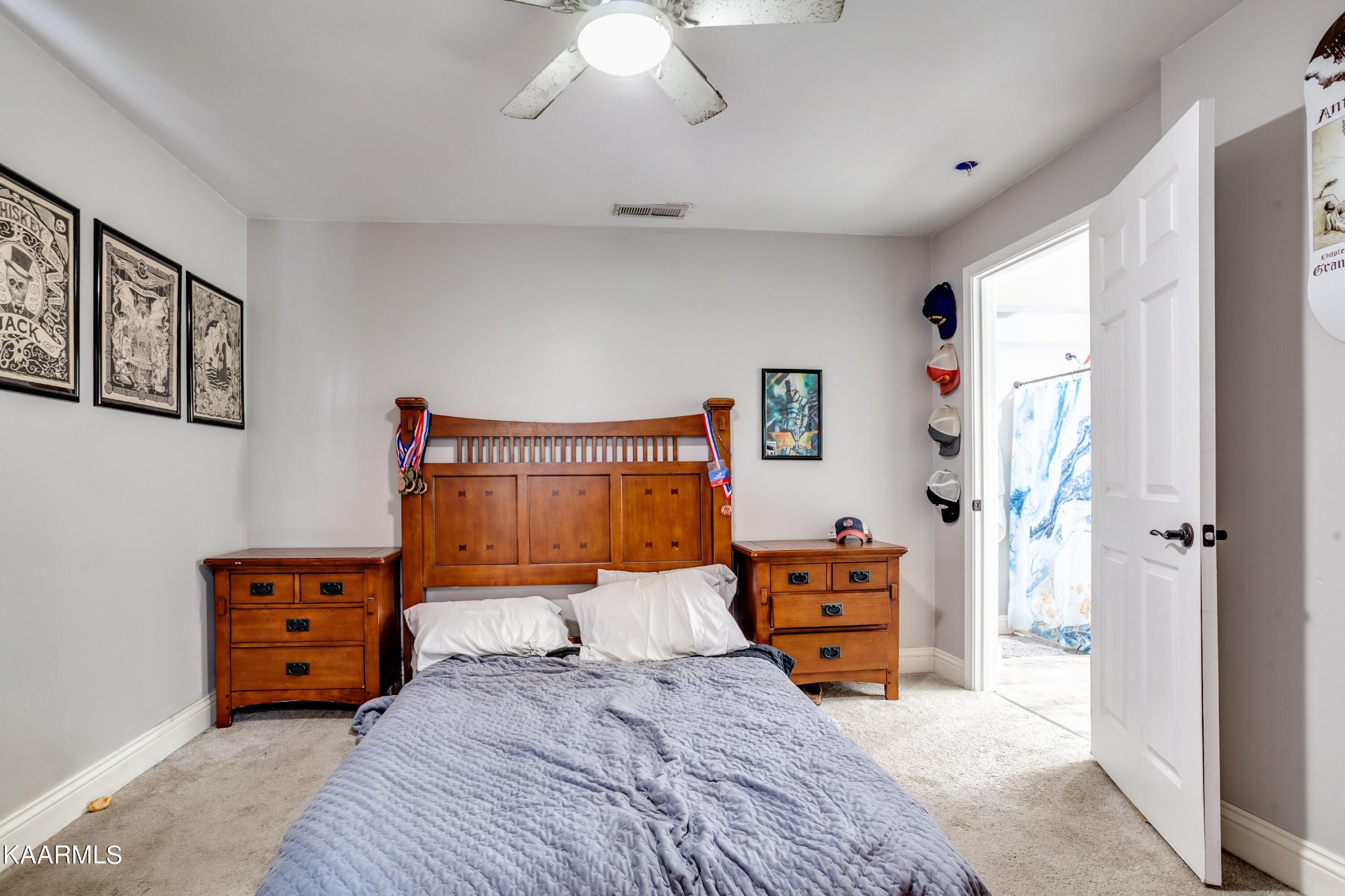 303 West Faunce Road Oak Ridge, TN 37830 - Photo 16 of 28 a bedroom with a bed and a chandelier
