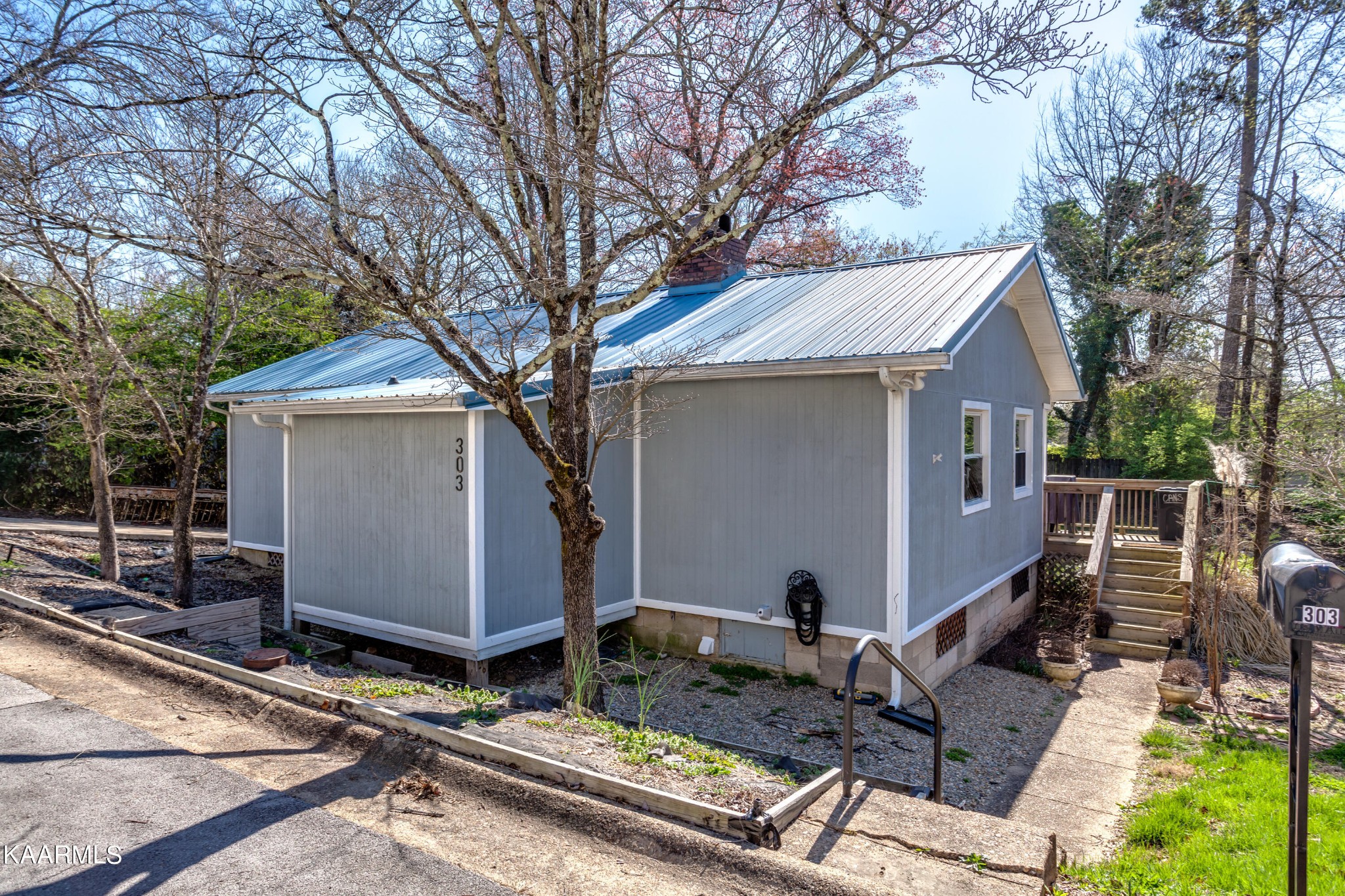 303 West Faunce Road Oak Ridge, TN 37830 - Photo 2 of 28 a view of backyard with a large tree and wooden fence
