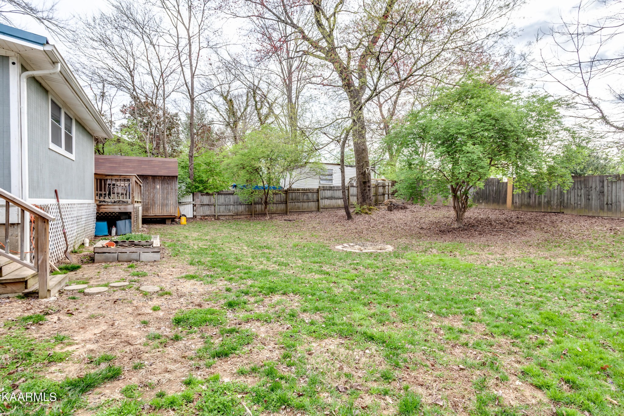 303 West Faunce Road Oak Ridge, TN 37830 - Photo 26 of 28 a backyard of a house with lots of green space
