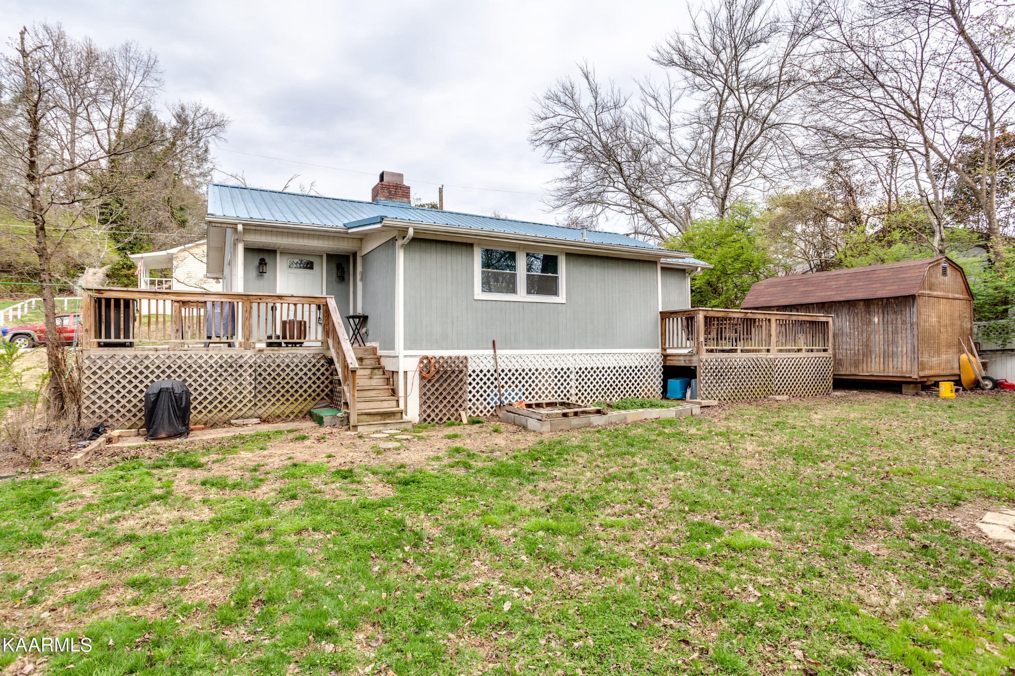 303 West Faunce Road Oak Ridge, TN 37830 - Photo 27 of 28 a front view of a house with a yard