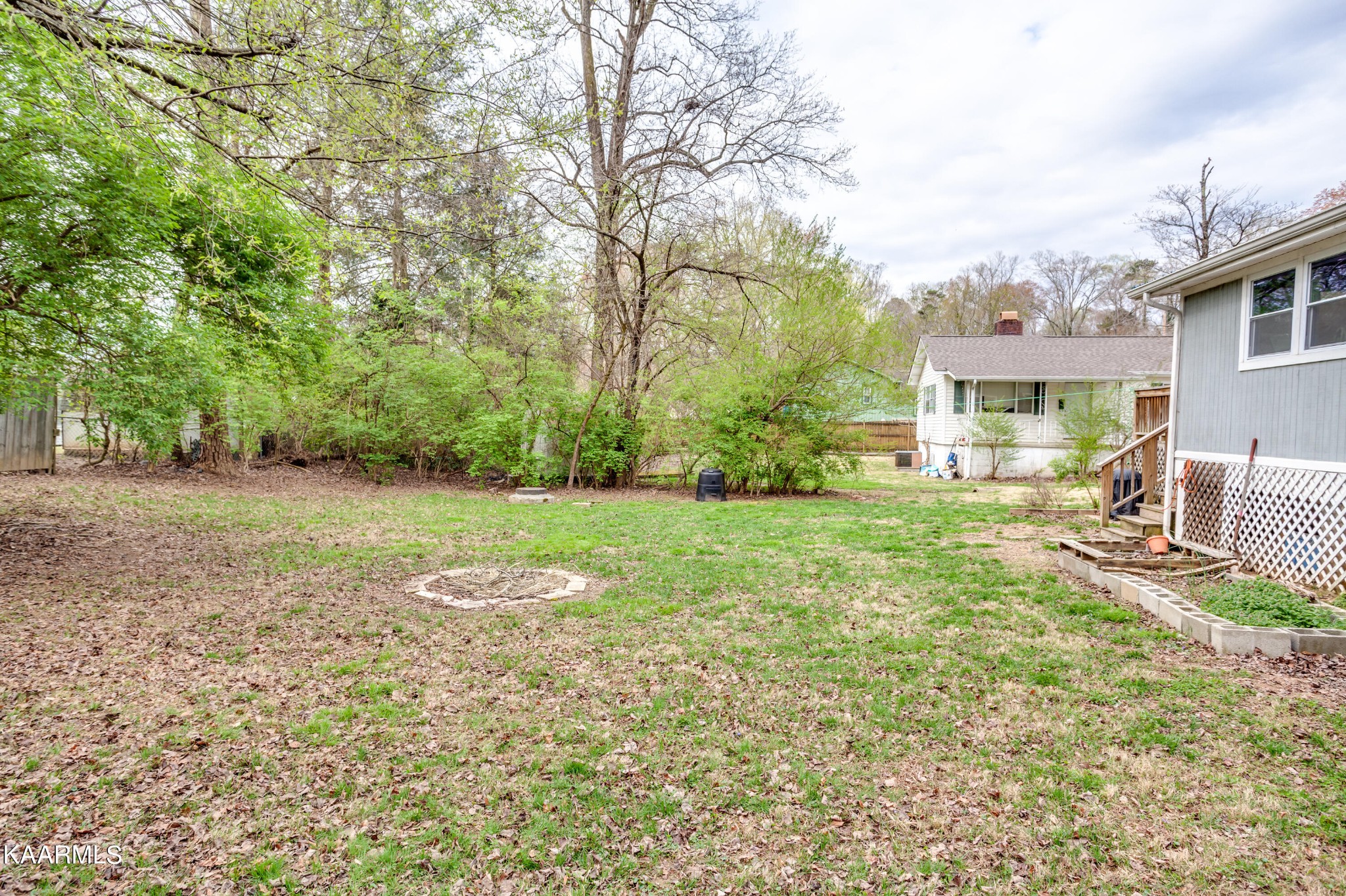 303 West Faunce Road Oak Ridge, TN 37830 - Photo 28 of 28 a view of a house with backyard and a tree