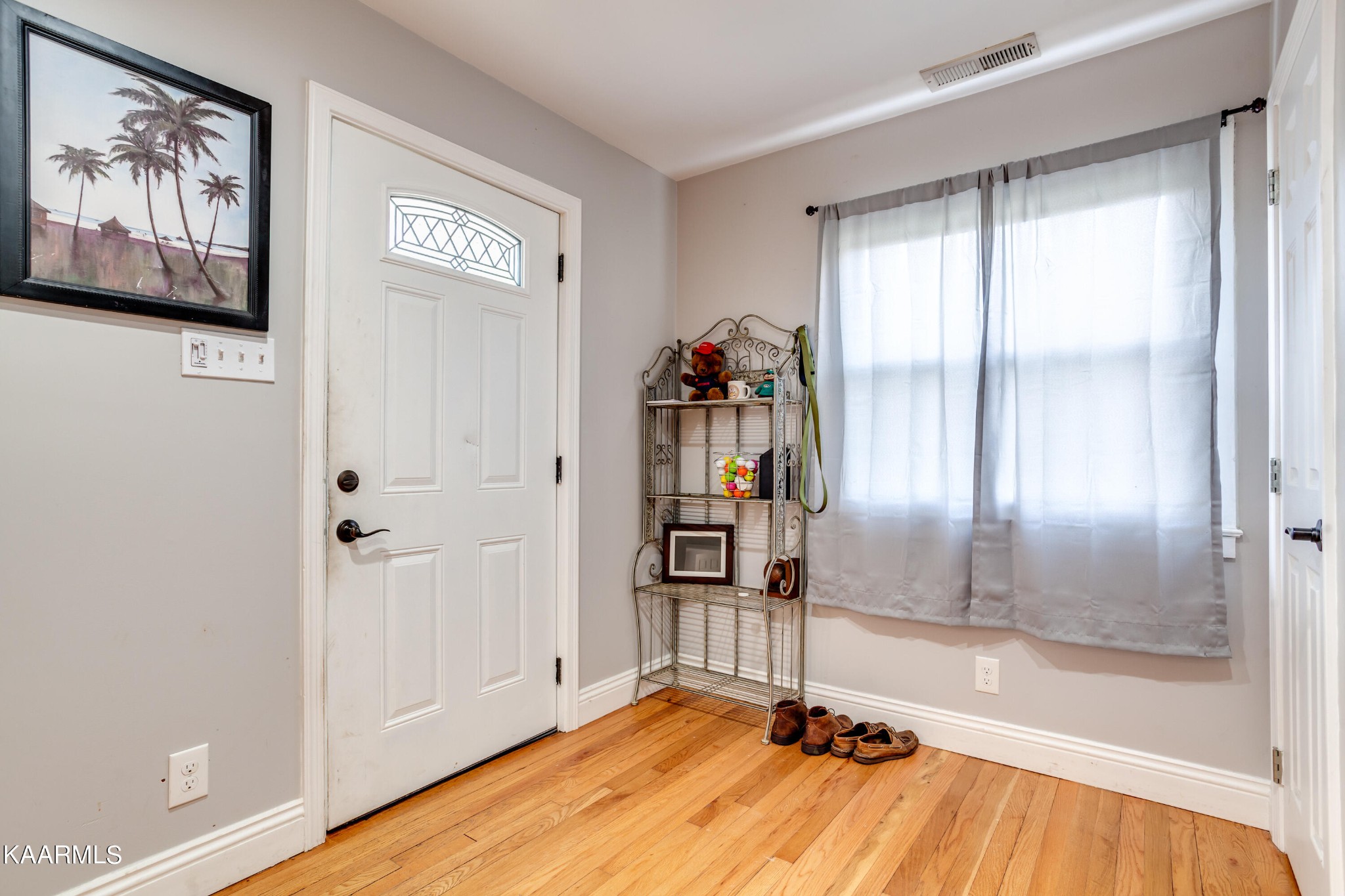 303 West Faunce Road Oak Ridge, TN 37830 - Photo 7 of 28 a view of a room with wooden floor and natural light