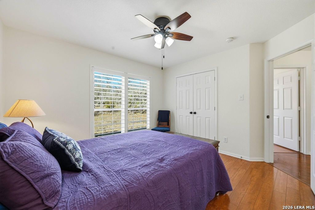 318 River Ridge Boerne, TX 78006 - Photo 32 of 46 a bed sitting in a bedroom next to a window