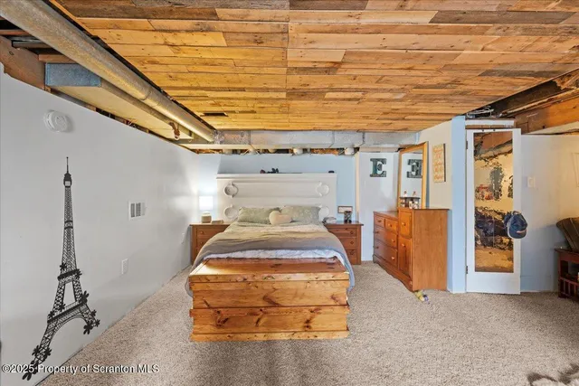 a bed room with a bed and a table