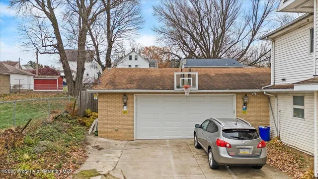 a front view of a house with parking space