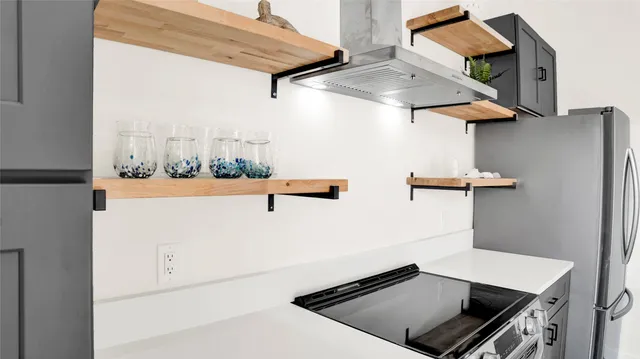 a bedroom with a bed and a table