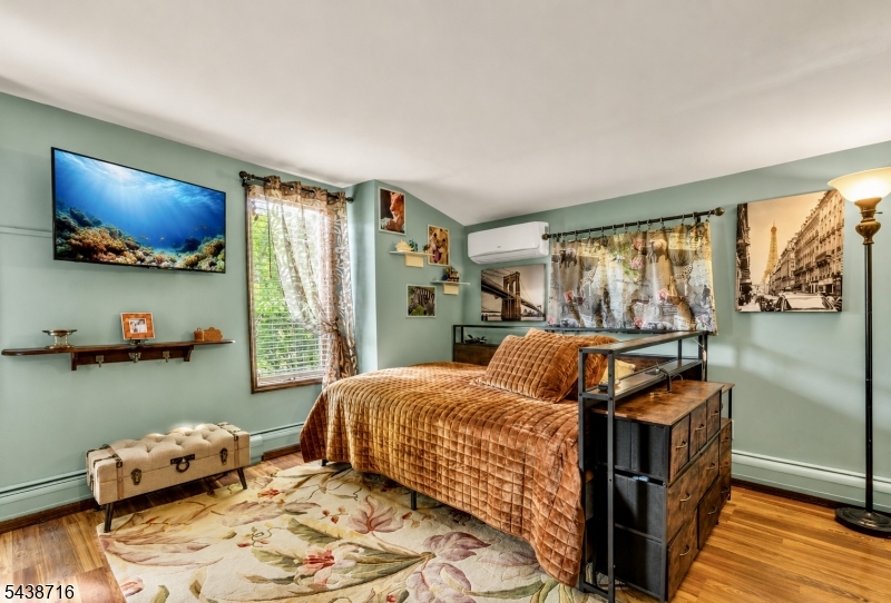 11 Rippling Brook Drive Vernon, NJ 07422 - Photo 23 of 49 a bedroom with furniture and a flat screen tv